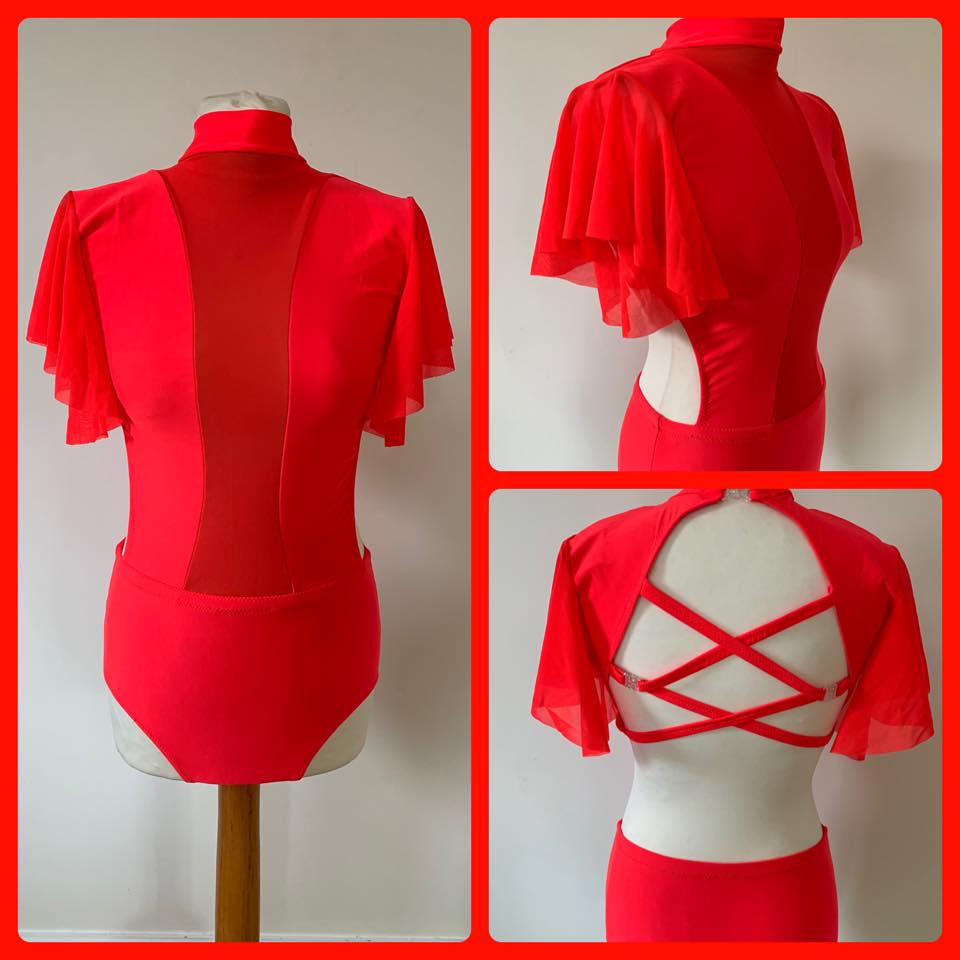 Lycra suit with mesh panel, flutter sleeves and criss cross straps