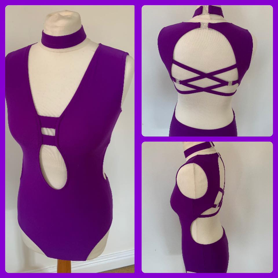 Suit with front cut out and criss cross back