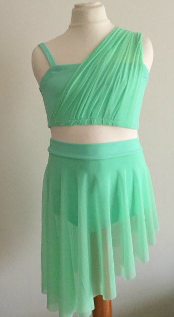 lyrical two piece with pleated shoulder and asymmetric skirt